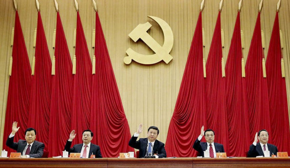Xi, center, is also the General Secretary of the governing Communist Party of China. | Xinhua/AP