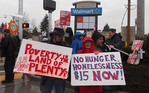 Undaunted by rain, Tacoma marchers demand “$15 now!”