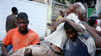 Haitians hold onto life as help mounts