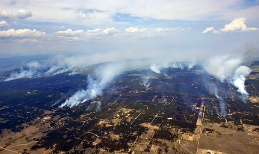 Colorado fires blaze on as workers rush to fight them