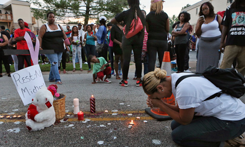 Ferguson, Missouri residents grieve and protest in wake of killing by police