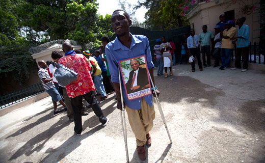 Amid Haiti election dispute, ex-President Aristide under house arrest
