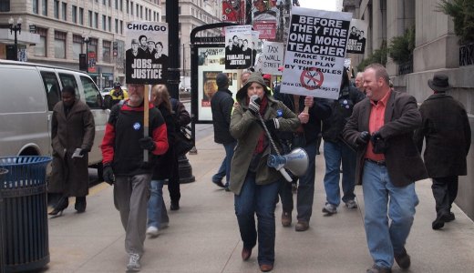 Video: Chicagoans march on monthly jobs report