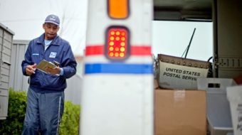 A mailman offers a big bear hug in sympathy and harmony