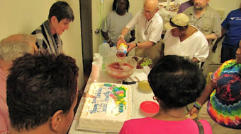 At Social Security birthday party, Rosa DeLauro cuts the cake