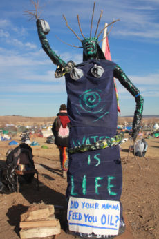 NO DAPL statue posted at entrance of Oceti Sakowin camp. Michelle Zacarias | PW