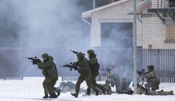 NATO soldiers take part in a military exercise in Lithuania on Dec. 2, 2016. The country is a former Soviet republic on Russia's western border. | Mindaugas Kulbis / AP