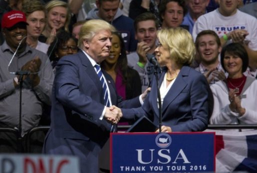 Betsy DeVos, prominent school voucher and religious school advocate, is Trump's pick to head up the Department of Education. | Cory Morse / The Grand Rapids Press via AP