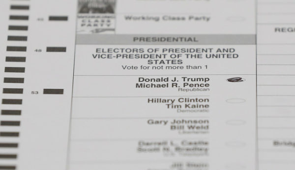 A ballot marked for Donald Trump is shown during a statewide recount in Waterford Township, Mich. on Dec. 5, 2016. | Paul Sancya / AP