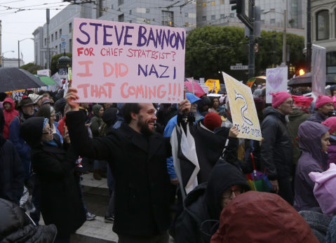 A man holds a sign for Steve Bannon in a women's march during the first full day of Donald Trump's presidency in San Francisco, Saturday, Jan. 21, 2017. | Jeff Chiu/AP