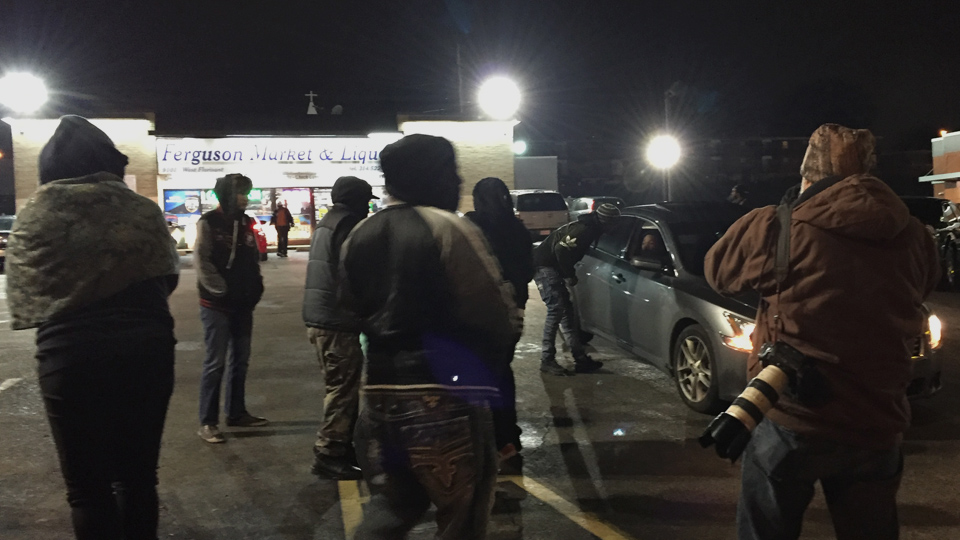 Activists call for a boycott of the Ferguson Market and Liquor convenience store