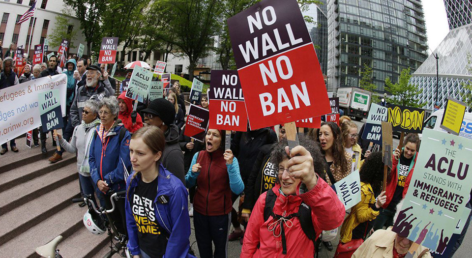 Federal judge hands a partial defeat to Trump’s travel ban