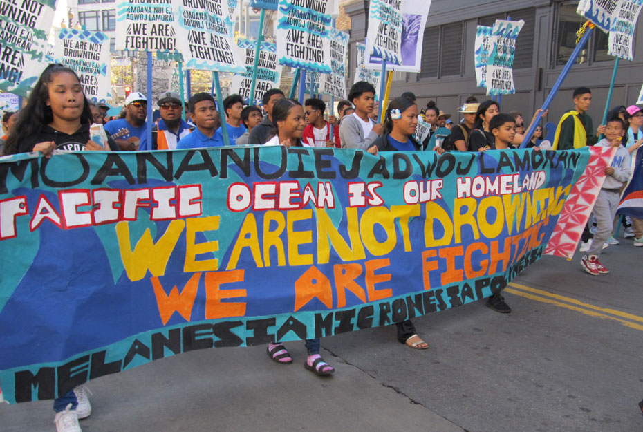 Tens of thousands march for climate, jobs and justice