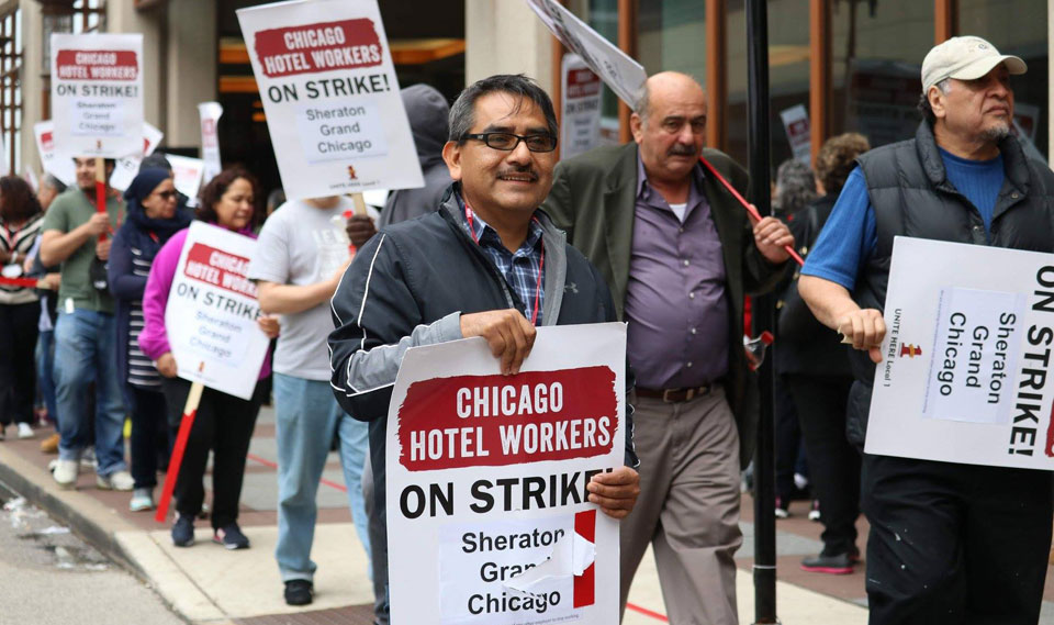 Thousands of striking Chicago hotel workers take over Magnificent Mile