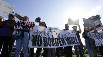 Thousands protest at the border as Trump tours Texas wall site
