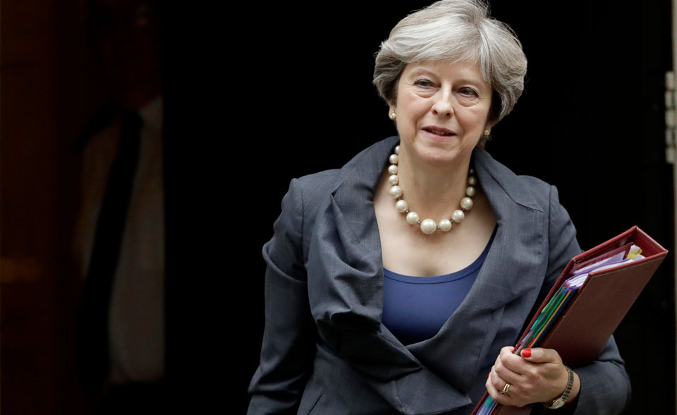 British Prime Minister Theresa May lives to negotiate Brexit another day