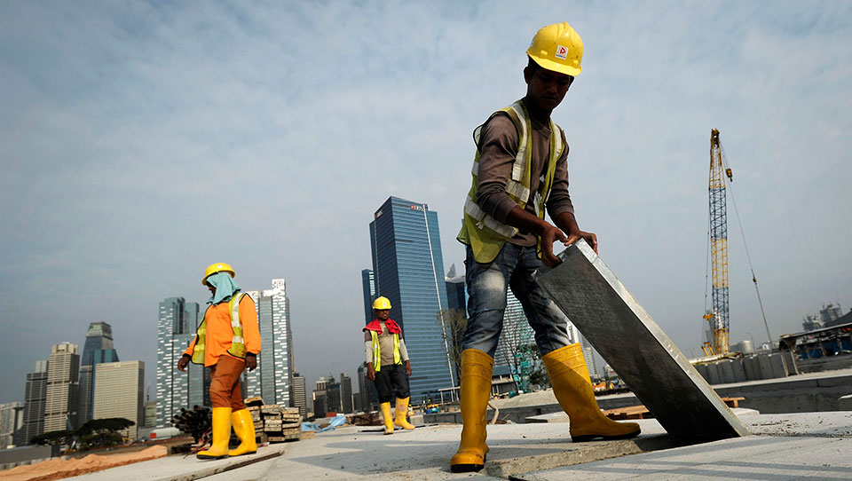 Low-paid migrant workers bear the worst of Singapore's ...