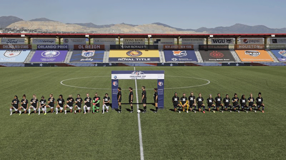 NWSL players take a knee during the national anthem