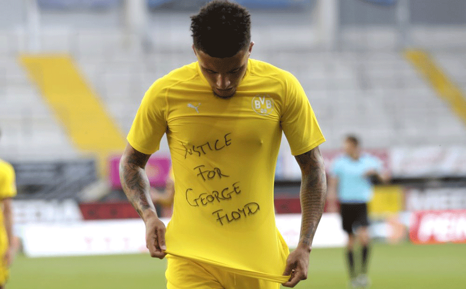 Soccer player Jadon Sancho stands for George Floyd on pitch, faces punishment