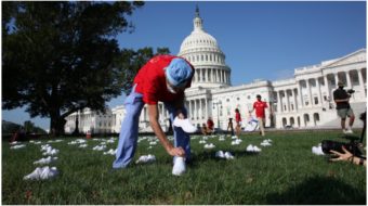 Bringing empty shoes to honor the dead, nurses descend on Capitol