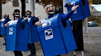 Put postal workers on the list of election heroes