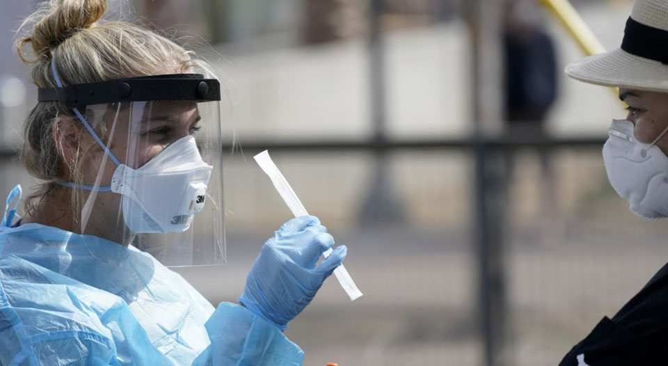 Coronavirus surge again exposes U.S. for-profit health care ‘system’