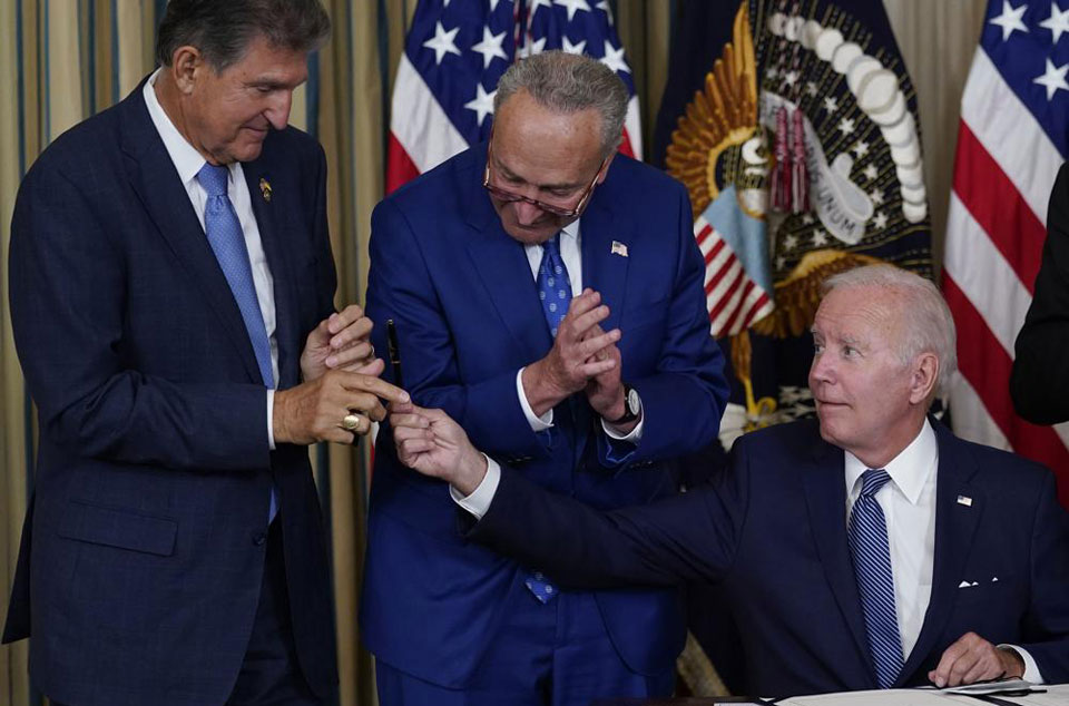 Biden signs Inflation Reduction Act, bringing historic climate crisis investment