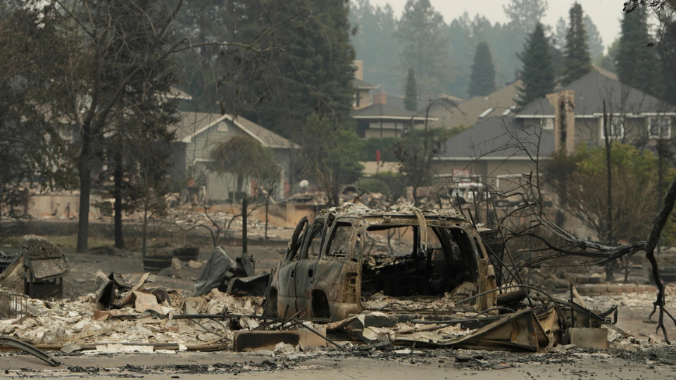 Spokane below my wings, lost in smoke, all ashes